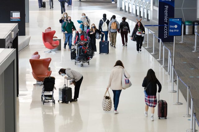 Passengers walk through the terminal at San Francisco International Airport. Stanford researchers have detected the new COVID-19 variant NB.1.8.1 in international travelers screened at airports in several states, including California.
