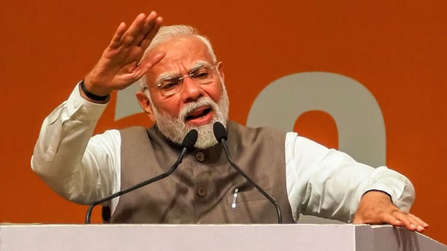 Prime Minister Narendra Modi addresses the gathering during an event marking 20 years of the Gujarat Urban Growth Story at Gandhinagar, in India's state of Gujarat, on May 27, 2025.