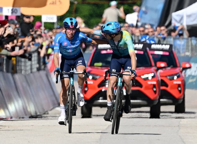 Cycling - Giro d'Italia - Stage 16 - Piazzola sul Brenta to San Valentino - Italy - May 27, 2025 XDS Astana Team's Christian Scaroni celebrates after winning stage 16, alongside second placed XDS Astana Team's Lorenzo Fortunato REUTERS/Jennifer Lorenzini