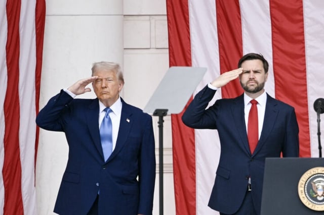 US President Donald Trump and US Vice President JD Vance salute at the National Memorial Day Observance at the Memorial Amphitheatre in Arlington National Cemetery in Arlington, Virginia, on May 26, 2025. (Photo by Brendan SMIALOWSKI / AFP) (Photo by BRENDAN SMIALOWSKI/AFP via Getty Images)