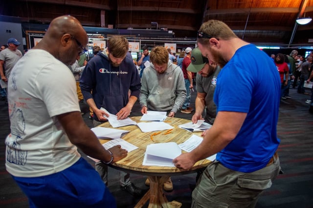 Pratt &amp; Whitney employees look through the latest proposal at the Oakdale Theatre in Wallingford before voting, Tuesday, May 27, 2025. (Aaron Flaum/Hartford Courant)