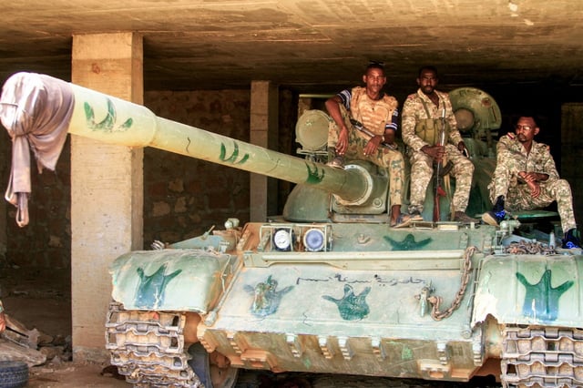 Sudanese soldiers on a tank after they captured a base used by the RSF in the Salha area of Omdurman, on May 26
