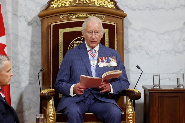Britain's King Charles delivers a Speech from the Throne next to Canada's Prime Minister Mark Carney at the Senate Chamber in Ottawa on Tuesday.