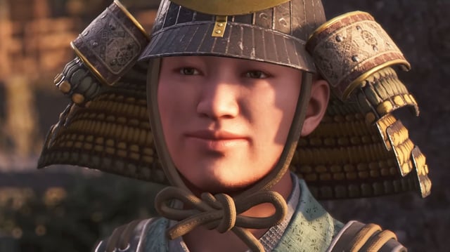 Assassin's Creed Shadows romance options - A close-up shot of Hori Hidemasa smiling, wearing his samurai armour and helmet.