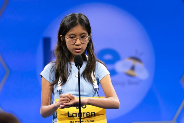 Lauren A. Merillana, 13, of Bethesda, Md., spells her word as she competes during the first preliminary round of the Scripps National Spelling Bee at the Gaylord National Resort &amp; Convention Center, Tuesday, May 27, 2025, in Oxon Hill, Md. (AP Photo/Jose Luis Magana)