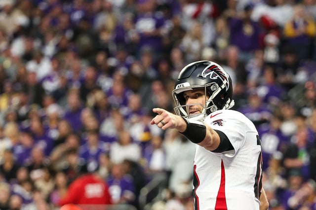 Dec 8, 2024; Minneapolis, Minnesota, USA; Atlanta Falcons quarterback Kirk Cousins (18) celebrates running back Bijan Robinson's (7) touchdown against the Minnesota Vikings during the third quarter at U.S. Bank Stadium. Mandatory Credit: Matt Krohn-Imagn Images