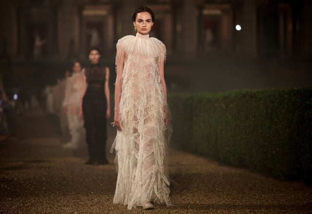 Models present creations by designer Maria Grazia Chiuri during the Christian Dior Cruise 2026 collection show at Villa Albani Torlonia in Rome, Italy, May 27, 2025. REUTERS/Guglielmo Mangiapane