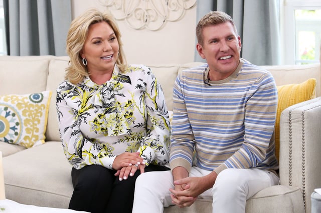 In this 2018 photo, reality TV Personalities Julie Chrisley, left, and and Todd Chrisley visit Universal Studios Hollywood in Universal City, California.
