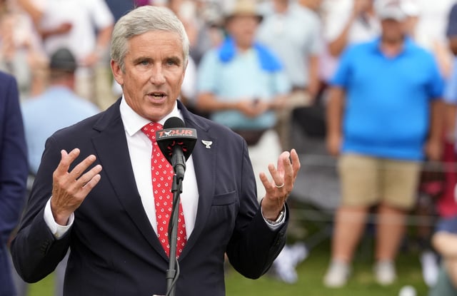 Sep 1, 2024; Atlanta, Georgia, USA; PGA TOUR Commissioner Jay Monahan addresses the gallery gathered on the 18th green after the final round of the TOUR Championship golf tournament. Mandatory Credit: John David Mercer-USA TODAY Sports