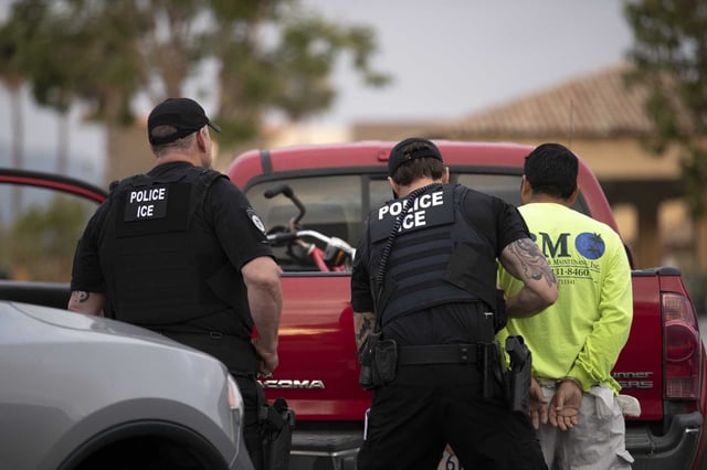 In this 2019 file photo, U.S. Immigration and Customs Enforcement (ICE) officers detain a man in Escondido, Calif. On Tuesday, immigrants who showed up to immigration court appointments in San Francisco and Concord were arrested by ICE officers.