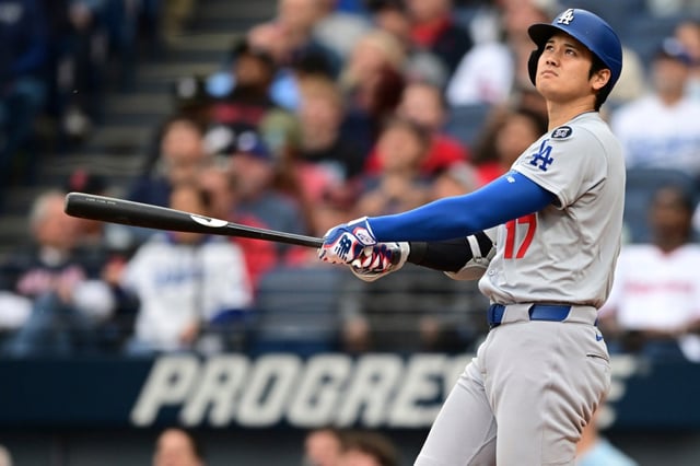 Dodgers star Shohei Ohtani watches the flight of his two-run home run during the fourth inning of their game against the Cleveland Guardians on Tuesday night in Cleveland. It was his 20th homer of the season. (AP Photo/David Dermer)
