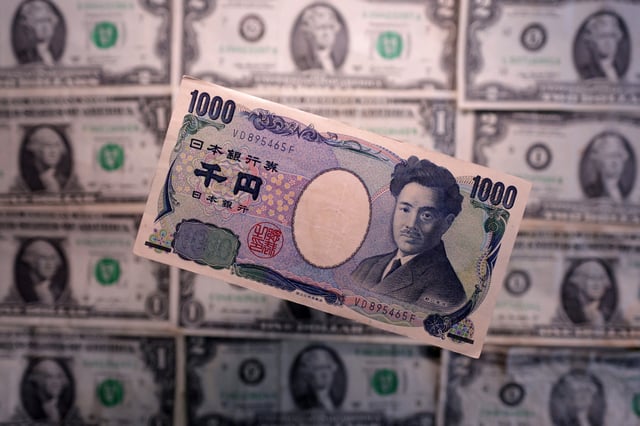 Yen and U.S. dollar banknotes are seen in this illustration taken March 19, 2025. REUTERS/Dado Ruvic/Illustration