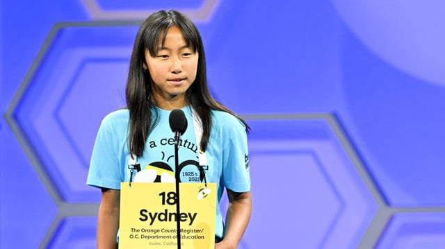 Speller Sydney Tran, of Irvine, CA, representing The Orange County Register/O.C. Department of Education, competes in a preliminary round for the 2025 Scripps National Spelling Bee on May 27, 2025 in National Harbor, MD. (Craig Hudson / Scripps National Spelling Bee)