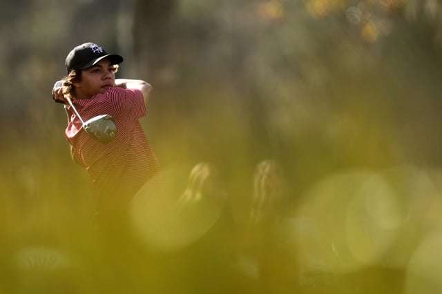 Charlie Woods of the United States plays his shot from the 14th tee during the second round of the PNC Championship at Ritz-Carlton Golf Club on December 22, 2024 in Orlando, Florida.