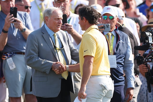 Jack Nicklaus shakes hands with Rory McIlroy of Northern Ireland on the 18th green during the final round of the Memorial Tournament presented by Workday at Muirfield Village Golf Club on June 04, 2023 in Dublin, Ohio.