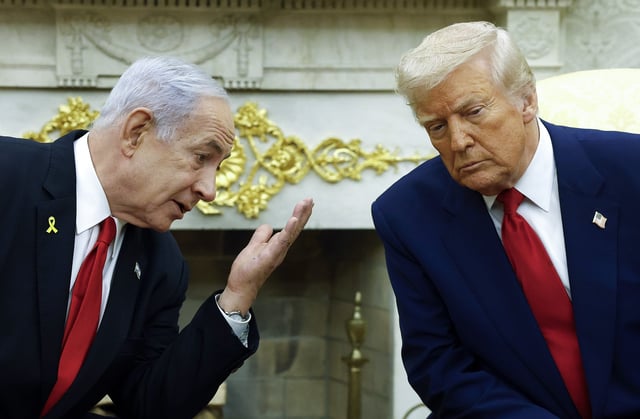 Israeli Prime Minister Benjamin (L) talks to U.S. President Donald Trump during a meeting in the Oval Office of the White House on April 7, 2025 in Washington, DC. President Trump is meeting with Netanyahu to discuss ongoing efforts to release Israeli hostages from Gaza and newly imposed U.S. tariffs.