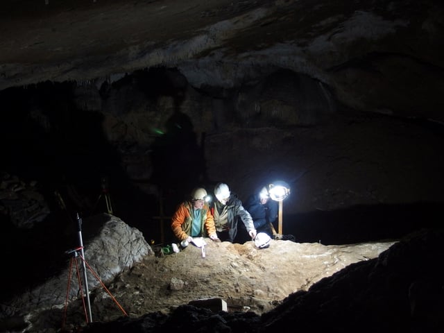 Researchers work in an excavation site where several dozen whale bone objects were discovered at the Basque cave of Isturitz, France, April 29, 2022. Jean-Marc Petillon, Christian Normand/Handout via REUTERS/File Photo