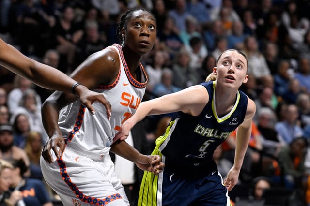 In a UConn reunion, Paige Bueckers prevailed, getting her first pro win against Tina Charles (left) and the  Connecticut Sun Tuesday night. (Jessica Hill/Special to the Courant)