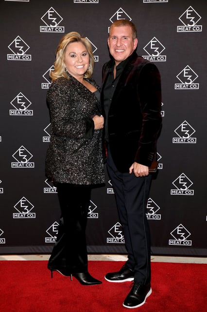 Julie Chrisley (L) and Todd Chrisley attend the grand opening of E3 Chophouse Nashville on November 20, 2019 in Nashville, Tennessee.