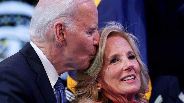 Former President Joe Biden kisses Jill Biden after she received a Department of Defense medal for Distinguished Public Service