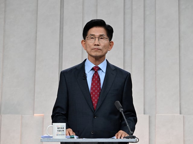 South Korea's presidential candidate, Kim Moon Soo of the People Power Party poses for photograph ahead of a third televised presidential debate for the forthcoming June 3 presidential election at MBC studio on May 27, 2025 in Seoul, South Korea. Kyodo/Kim Min-Hee/Pool via REUTERS/File Photo