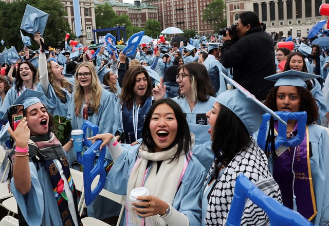 Students attend Columbia University commencement ceremony on Columbia's main campus, in Manhattan, New York City, U.S., May 21, 2025. REUTERS/Jeenah Moon/Pool/File Photo