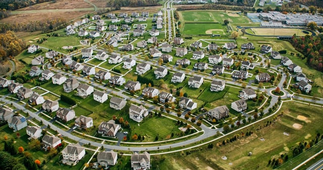 Helicopter shot of residential streets in Montgomery County, Maryland, north of Washington, D.C. on a hazy afternoon in Fall.