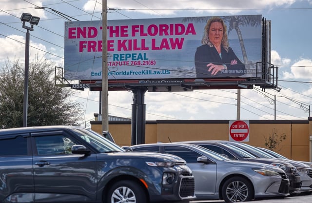 A billboard reads: &#34;END THE FLORIDA FREE KILL LAW; REPEAL STATUTE 768.21(8); EndTheFloridaFreeKillLaw.US; PAID FOR BY MARY JO CAIN REIS,” near the intersection of South Semoran Boulevard &amp; Gatlin Avenue in Orlando, on Thursday, November 2, 2023. (Ricardo Ramirez Buxeda/ Orlando Sentinel)