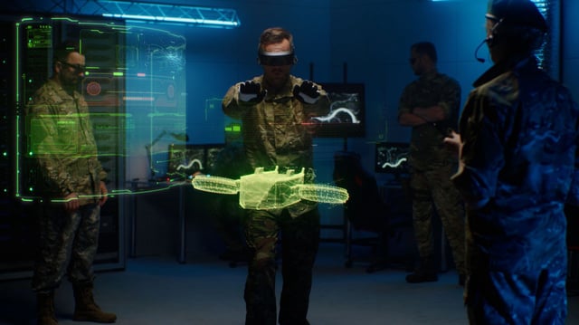 Group of servicemen in VR goggles testing model of military drone in holographic program