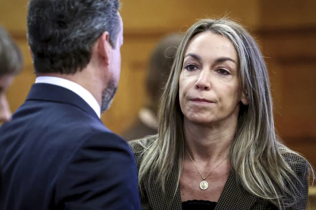 Karen Read speaks with her defense attorney, Alan Jackson, during her retrial in Norfolk Superior Court, on May 29, 2025, in Dedham, Mass.