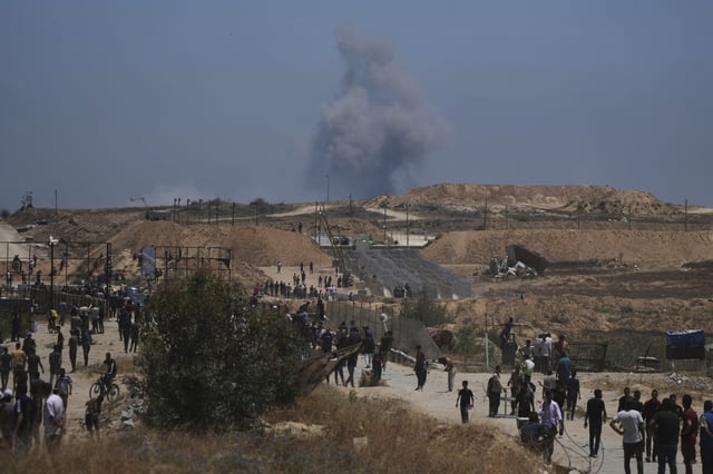Smoke rises following an Israeli bombardment in southern Gaza, as seen from a humanitarian aid distribution center operated by the U.S.-backed Gaza Humanitarian Foundation, approved by Israel, in Khan Younis, southern Gaza Strip, on Thursday, May 29, 2025.