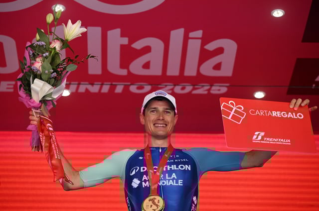 Cycling - Giro d'Italia - Stage 19 - Biella to Champoluc - Italy - May 30, 2025 Decathlon AG2R La Mondiale Team's Nicolas Prodhomme celebrates on the podium after winning stage 19 REUTERS/Jennifer Lorenzini