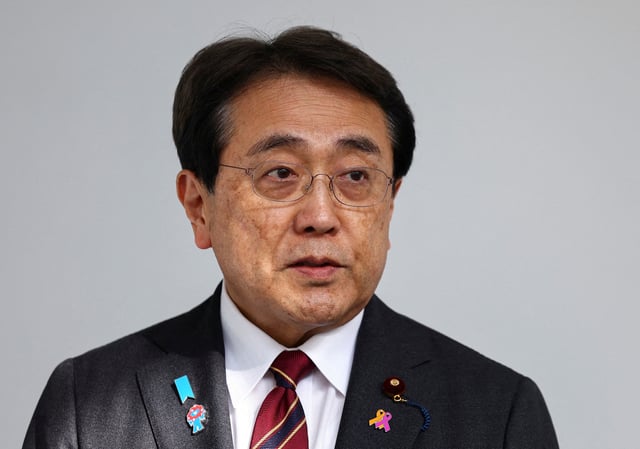 Japan's Economic Revitalization Minister Ryosei Akazawa speaks to the press upon his arrival at Haneda Airport, a day after ministerial talks on tariffs, with U.S. President Donald Trump joining the negotiators, in Tokyo, Japan, April 18, 2025. REUTERS/Issei Kato/File Photo