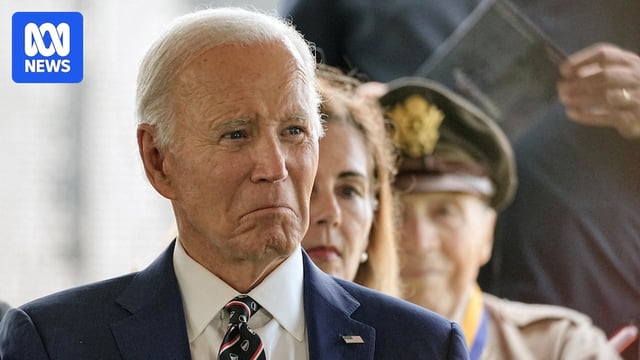 close up of Joe Biden at a veterans ceremony in delaware, he is frowning