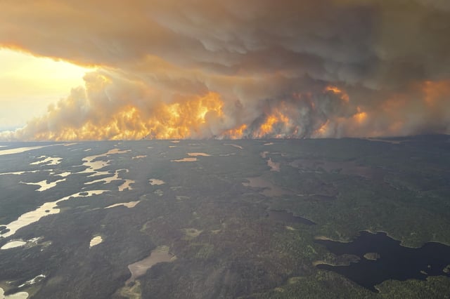 This photo provided by the Manitoba government shows wildfires in Flin Flon, Manitoba, Canada on Tuesday, May 27, 2025. (Manitoba government via AP)