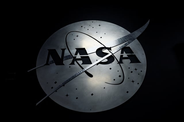 The NASA logo hangs in the Mission Operations Control Center at Wallops Flight Facility on Wallops Island, Virginia, U.S., October 26, 2022. REUTERS/Evelyn Hockstein/File Photo