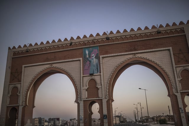 FILE - An archway in the entrance of Dakhla carries an image of Morocco's King Mohammed VI, in Western Sahara, Monday, Dec. 21, 2020. (AP Photo/Mosa'ab Elshamy, File)
