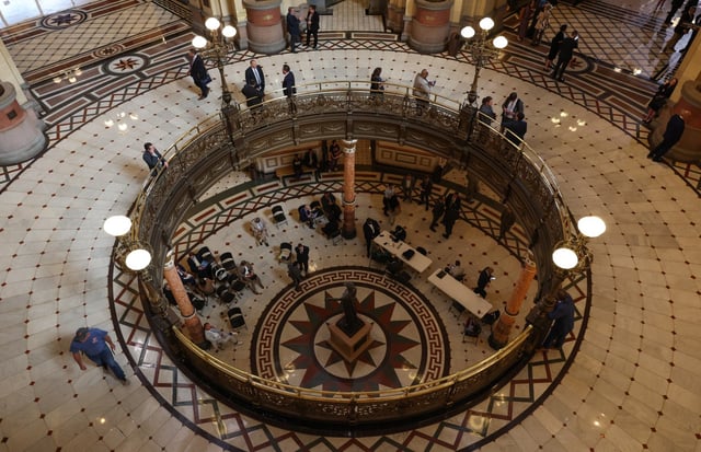 People stand at the balcony in the Illinois State Capitol in Springfield on May 28, 2025. (John J. Kim/Chicago Tribune)