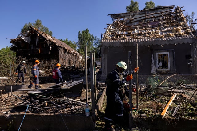 Emergency service members work at the site where Russian drones damaged several private houses, amid Russia's attack on Ukraine, in Zaporizhzhia, Ukraine, June 1, 2025. REUTERS/Thomas Peter