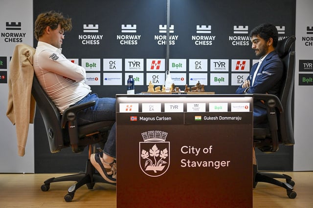 Magnus Carlsen (left) suffered a surprise loss to Gukesh Dommaraju (right) at the Norway Chess tournament.
