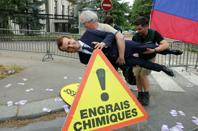 Greenpeace activists made away with a wax figure of French President Emmanuel Macron, which had been hidden under a blanket