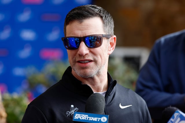 GLENDALE, ARIZONA - FEBRUARY 14: President of Baseball Operations Andrew Friedman of the Los Angeles Dodgers speaks to the media during spring training workouts at Camelback Ranch on February 14, 2025 in Glendale, Arizona.