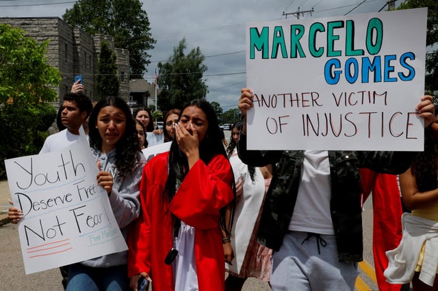 Classmates of Marcelo Gomes da Silva, who was reportedly detained by Immigration and Customs Enforcement (ICE) agents, join members of the community at a rally in support of da Silva after their high school graduation in Milford, Massachusetts, U.S., June 1, 2025.   REUTERS/Brian Snyder/File Photo