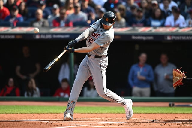 Oct 12, 2024; Cleveland, Ohio, USA; Detroit Tigers outfielder Parker Meadows (22) hits a double in the second inning against the Cleveland Guardians during game five of the ALDS for the 2024 MLB Playoffs at Progressive Field. Mandatory Credit: Ken Blaze-Imagn Images