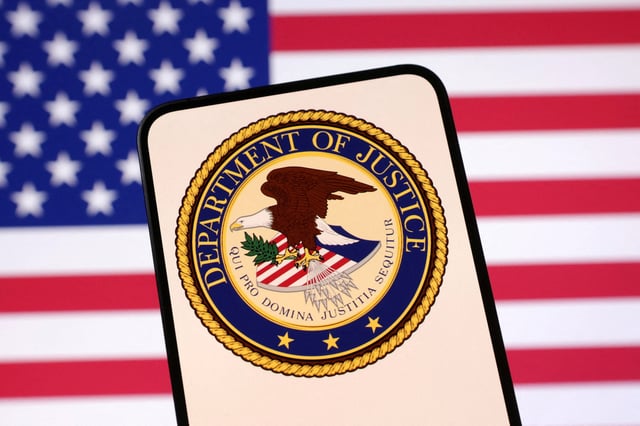 United States Department of Justice logo and U.S. flag are seen in this illustration taken April 23, 2025. REUTERS/Dado Ruvic/Illustration/File Photo