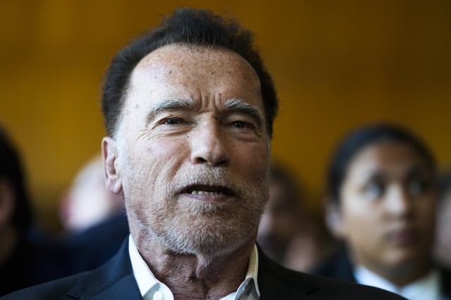 FILE - Former California Gov. and actor Arnold Schwarzenegger, center, arrives for a ceremony to receive a honorary doctorate by the Hertie School, a university of governance, in Berlin, Germany, Tuesday, Sept. 17, 2024. (AP Photo/Markus Schreiber, File)