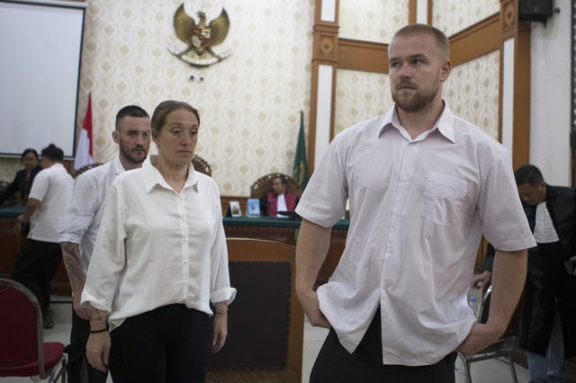 British nationals, from left, Jonathan Collyer, Lisa Stocker, and Phineas Float who are accused of smuggling nearly a kilogram (over two pounds) of cocaine into Indonesia leave the courtroom after their first trial hearing at Denpasar District Court in Denpasar, Bali, on Tuesday, June 3, 2025. (AP Photo/Firdia Lisnawati)