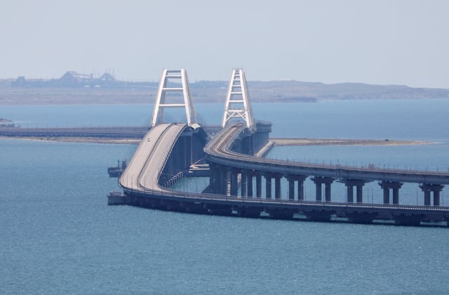 A view shows the Crimean Bridge, a section of which was damaged by an alleged overnight attack, as seen form the city of Kerch, Crimea, July 17, 2023. REUTERS/Alexey Pavlishak/File Photo