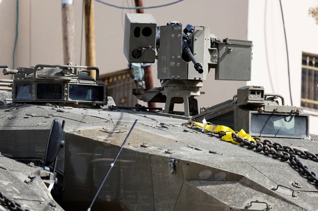 A remote controlled machine gun is attached to an Israeli military vehicle during an Israeli raid in Jenin, in the Israeli-occupied West Bank, March 4, 2025. REUTERS/Raneen Sawafta/File Photo