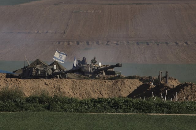 An Israeli artillery unit moves along the border with the Gaza Strip on January 19, 2024 in Southern Israel, Israel.